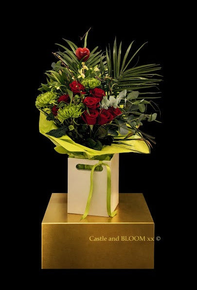 Extra large box of red roses, green chrysanthemum, eucalyptus, palm, cream alstromeria and heart pick.